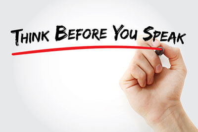Hand writing Think Before You Speak with marker concept background