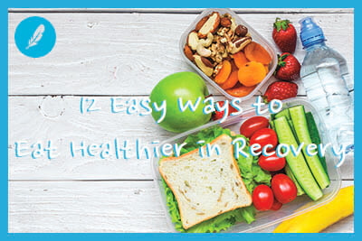 unch boxes with sandwich and fresh vegetables, bottle of water, nuts and fruits on white wooden background.